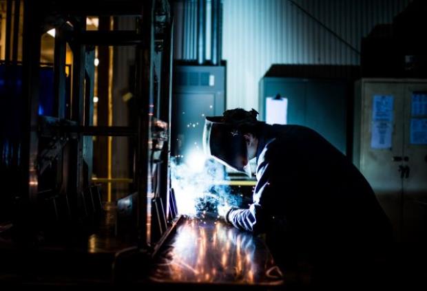 welder with helmet welding