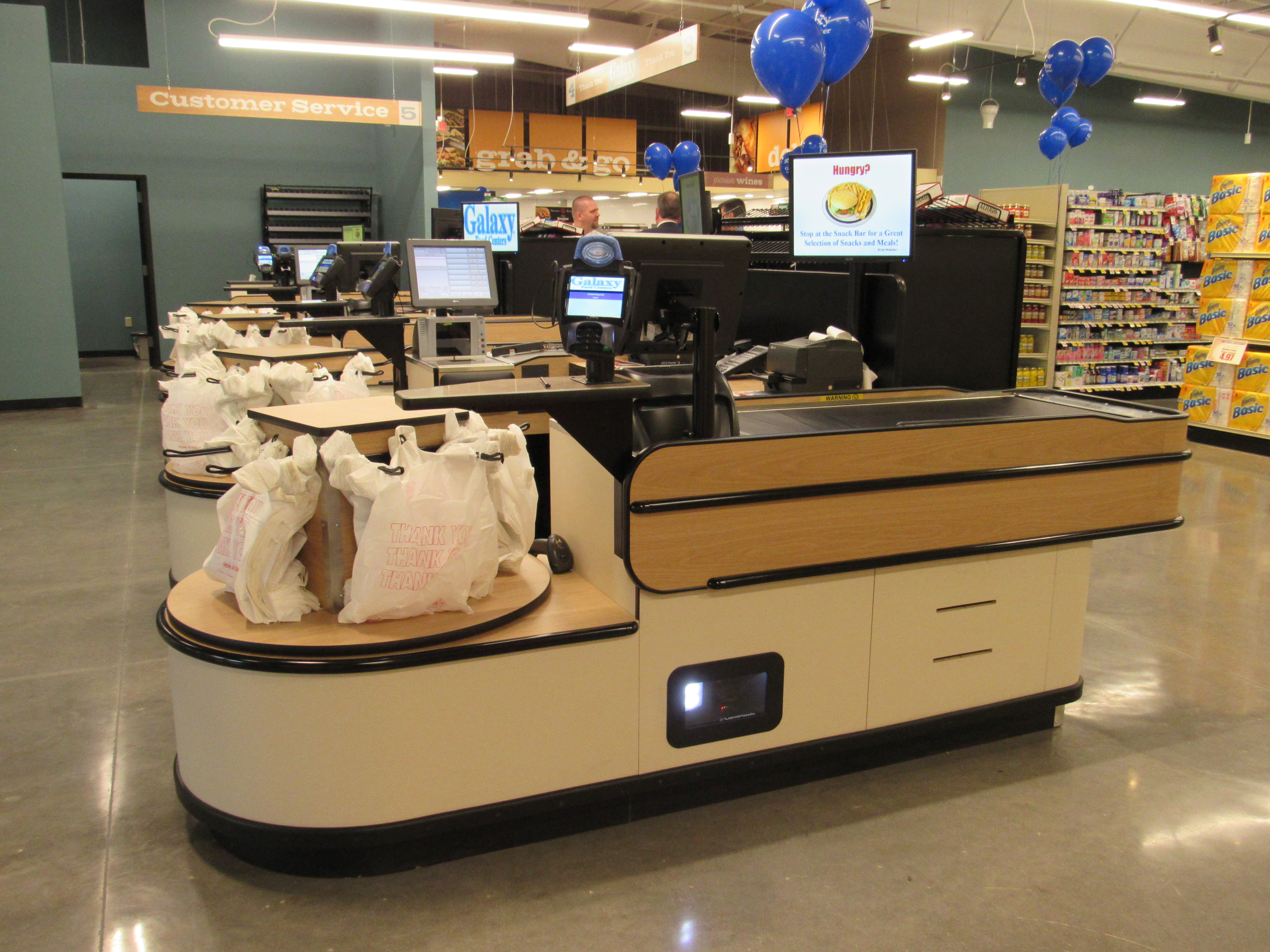 carousel bagger supermarket checkout lane